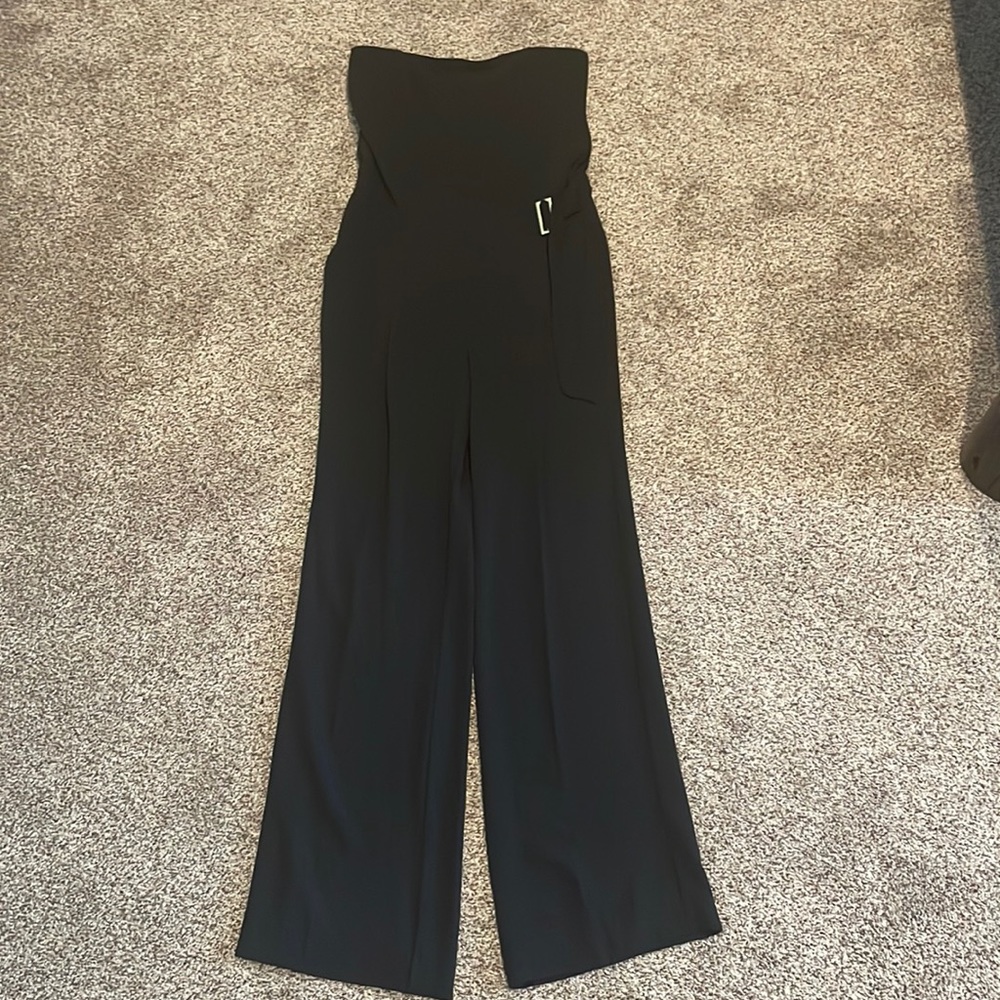 Rachel Roy black wide leg strapless jumpsuit. Wide legs and pockets.